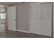 Hallway view with vinyl floors, white doors and light gray walls at 3601 Grayton Dr, New Port Richey, FL 34652