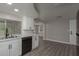 Modern kitchen with white cabinets, granite countertops, and black appliances at 3601 Grayton Dr, New Port Richey, FL 34652