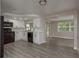 Modern kitchen with white cabinets, granite countertops, and black appliances at 3601 Grayton Dr, New Port Richey, FL 34652