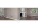 Open-concept living room flows into a bright kitchen featuring new laminate flooring at 3601 Grayton Dr, New Port Richey, FL 34652