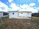 Backyard featuring a small shed and some trees at 37135 Sandra Ave, Zephyrhills, FL 33542