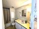 Functional bathroom with a sink, toilet, and shower-tub combo at 37135 Sandra Ave, Zephyrhills, FL 33542