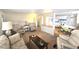 Cozy living room with open view to kitchen and dining area at 37135 Sandra Ave, Zephyrhills, FL 33542