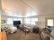 Inviting living room featuring cozy seating and ample natural light at 37135 Sandra Ave, Zephyrhills, FL 33542