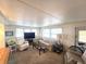 Bright living room with a large window offering a pleasant view at 37135 Sandra Ave, Zephyrhills, FL 33542