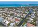 Aerial view of waterfront homes in Siesta Key, Florida with Gulf beaches and boat docks at 396 Avenida Madera, Sarasota, FL 34242