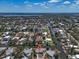 Scenic aerial view showcases a waterfront home with canal access in a desirable neighborhood at 396 Avenida Madera, Sarasota, FL 34242
