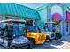 Colorful Beach Bazaar storefront with unique golf cart rentals and a variety of T-shirts for sale at 396 Avenida Madera, Sarasota, FL 34242