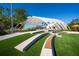 A park featuring a unique modern pavilion, lush green lawns and seating areas, perfect for outdoor gatherings at 396 Avenida Madera, Sarasota, FL 34242