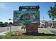 A colorful sign for Sarasota Jungle Gardens, a Gathering-friendly attraction with exotic animals and lush landscapes at 396 Avenida Madera, Sarasota, FL 34242