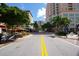 City street with modern buildings and lush greenery, creating a vibrant urban oasis with outdoor restaurants at 396 Avenida Madera, Sarasota, FL 34242