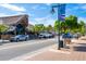 Lively street view of a Siesta Key street with shops, palms, and parked cars at 396 Avenida Madera, Sarasota, FL 34242