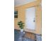 Close-up of the front door with security features, a potted plant, and a welcome mat creates a warm entry at 406 Country Club Dr, Oldsmar, FL 34677