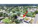 Beautiful aerial view of home with pool, lush landscaping, and a serene lake in a desirable neighborhood at 4175 20Th N St, St Petersburg, FL 33741