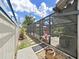Landscaped backyard showcasing the pool with screened enclosure and patio at 4175 20Th N St, St Petersburg, FL 33741