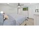 Comfortable primary bedroom featuring a flat screen TV, ceiling fan, and a queen-size bed at 4175 20Th N St, St Petersburg, FL 33741
