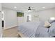 Primary bedroom featuring a ceiling fan, window and matching dressers with drawers and a queen bed at 4175 20Th N St, St Petersburg, FL 33741