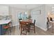 Cozy dining area with pendant lighting and a view to the outdoor patio through sliding glass doors at 4175 20Th N St, St Petersburg, FL 33741