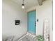 Welcoming turquoise front door with a cute key and tasteful decorative accents at 4175 20Th N St, St Petersburg, FL 33741