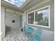 Cozy front porch area with a charming seating arrangement and stylish welcome decor at 4175 20Th N St, St Petersburg, FL 33741