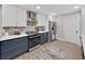 Well-lit kitchen featuring stainless steel appliances, modern cabinetry, and a decorative backsplash at 4175 20Th N St, St Petersburg, FL 33741