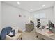 Bright home office with a comfortable chair, sleek desk, neutral colors, and ample natural light at 4175 20Th N St, St Petersburg, FL 33741