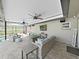 Relaxing screened patio with ceiling fans, TV, and comfortable seating offers ideal outdoor living space at 4175 20Th N St, St Petersburg, FL 33741