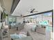 The covered lanai features a seating area, ceiling fans, recessed lighting, and a screened pool at 4175 20Th N St, St Petersburg, FL 33741