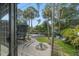 Modern backyard featuring a beautiful pool, landscaped garden, and contemporary patio design at 4610 Cypress S Way, St Petersburg, FL 33705