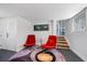 Basement area with retro decor, unique rug, and a stairway to another level at 4610 Cypress S Way, St Petersburg, FL 33705