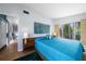 Bedroom boasts a sleek aesthetic and poolside views at 4610 Cypress S Way, St Petersburg, FL 33705