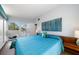 Bedroom with a bright color scheme and a view of the backyard and deck at 4610 Cypress S Way, St Petersburg, FL 33705