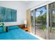 Bedroom with sliding glass doors and a view of the pool at 4610 Cypress S Way, St Petersburg, FL 33705