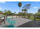 View from the deck showing mature trees and a view of the surrounding neighborhood at 4610 Cypress S Way, St Petersburg, FL 33705
