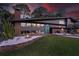 Beautiful mid-century modern home with brick and gray exterior, plus manicured lawn and garden at 4610 Cypress S Way, St Petersburg, FL 33705