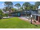 Beautiful mid-century modern home with brick walkway, xeriscaping, manicured lawn and landscaping at 4610 Cypress S Way, St Petersburg, FL 33705
