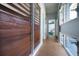 Hallway features wood slats and bright windows overlooking a garden at 4610 Cypress S Way, St Petersburg, FL 33705