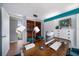 Office with sleek, modern design, desk, and view to backyard, creating a functional workspace with visual appeal at 4610 Cypress S Way, St Petersburg, FL 33705