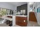Charming kitchen boasts an island with bar seating, stainless appliances, and easy access to the stairs at 4610 Cypress S Way, St Petersburg, FL 33705