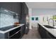 Modern kitchen boasts stainless appliances, tile backsplash, and an eat-in island with lots of natural light at 4610 Cypress S Way, St Petersburg, FL 33705