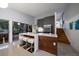 Charming kitchen boasts an island with bar seating, stainless appliances, and easy access to the stairs at 4610 Cypress S Way, St Petersburg, FL 33705