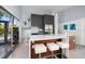 Bright kitchen features a breakfast bar with seating, stainless steel appliances, and modern cabinetry at 4610 Cypress S Way, St Petersburg, FL 33705