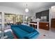 Modern living room with a casual bar, island seating, and access to an outdoor patio at 4610 Cypress S Way, St Petersburg, FL 33705