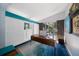 Bright office with a unique wood desk, blue accents, and backyard views at 4610 Cypress S Way, St Petersburg, FL 33705