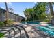 Backyard pool and lounge chairs are surrounded by a tropical landscape at 4610 Cypress S Way, St Petersburg, FL 33705