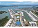 Aerial view showcasing community amenities including tennis courts, pool, clubhouse, and waterfront residences at 467 Boca Ciega Point S Blvd, St Petersburg, FL 33708