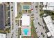 Aerial view of a community clubhouse, pool, shuffleboard, and parking at 467 Boca Ciega Point S Blvd, St Petersburg, FL 33708