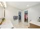 Bathroom features a marble counter, a closet and a doorway to the main bedroom at 467 Boca Ciega Point S Blvd, St Petersburg, FL 33708