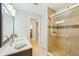 Well-lit bathroom with a modern vanity and shower at 467 Boca Ciega Point S Blvd, St Petersburg, FL 33708