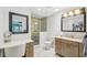 Full bathroom with a tiled shower, vanity, mirror, and tiled flooring at 467 Boca Ciega Point S Blvd, St Petersburg, FL 33708